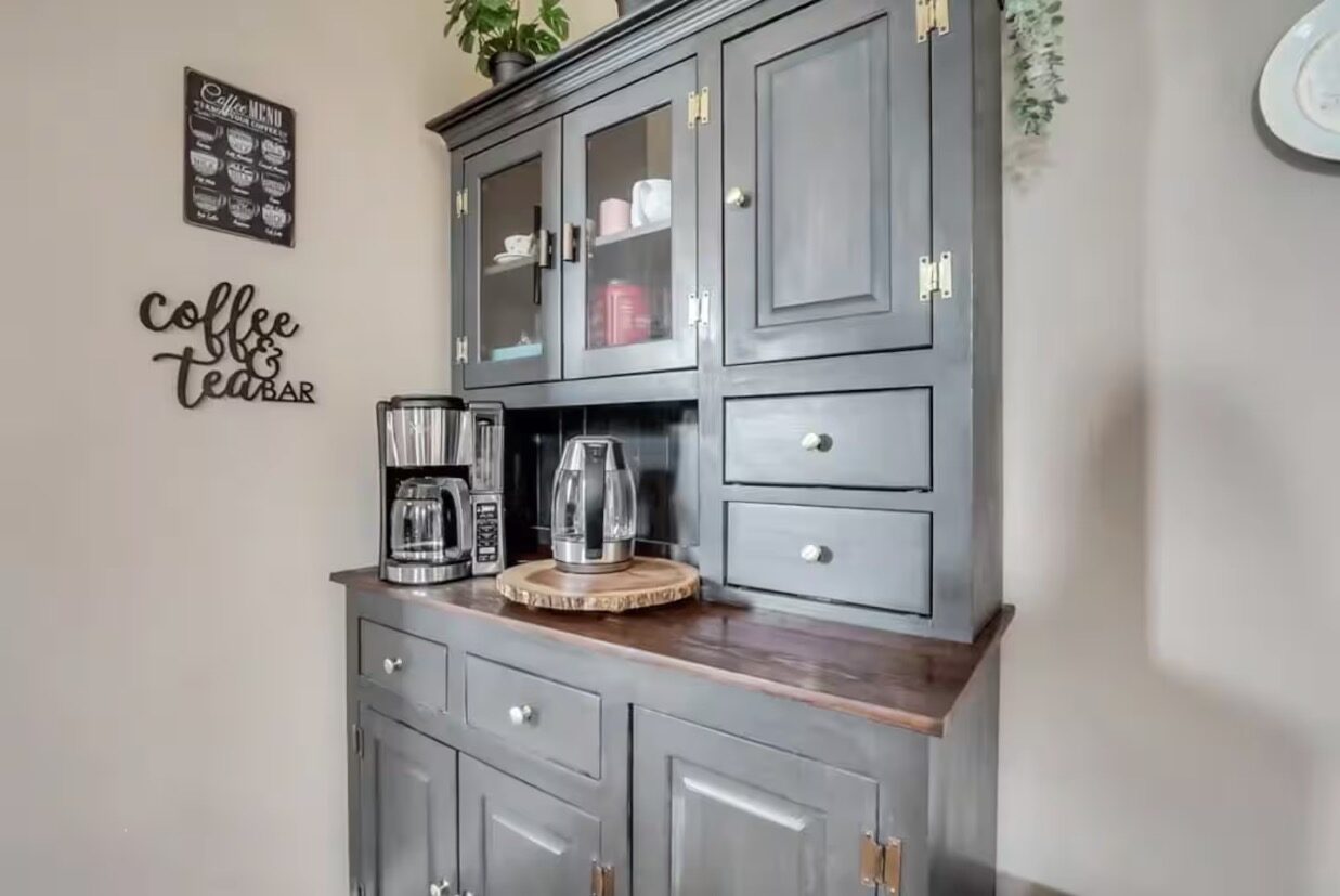 Coffee and tea bar with vintage-style cabinet