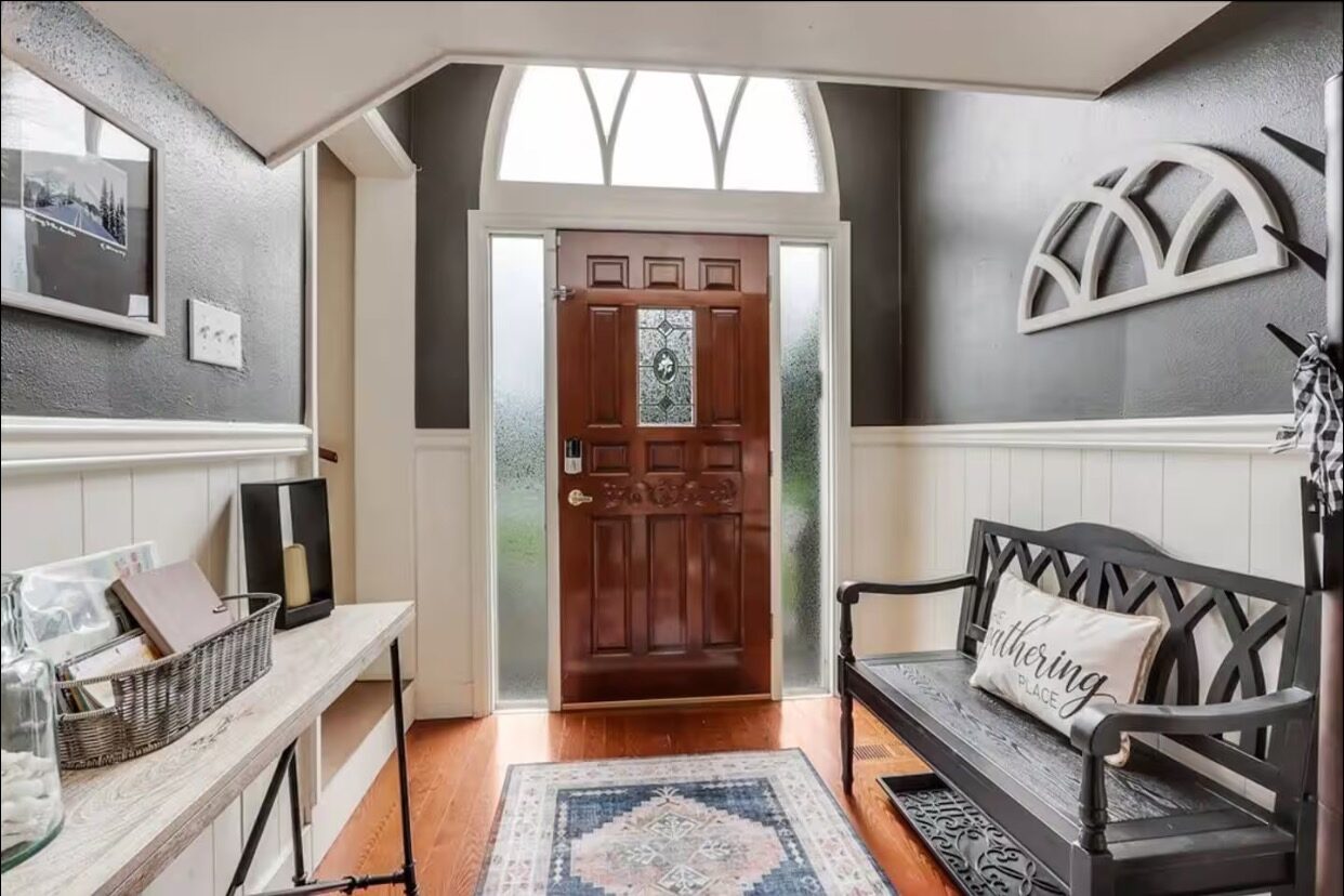 Entryway with original stained-glass front door