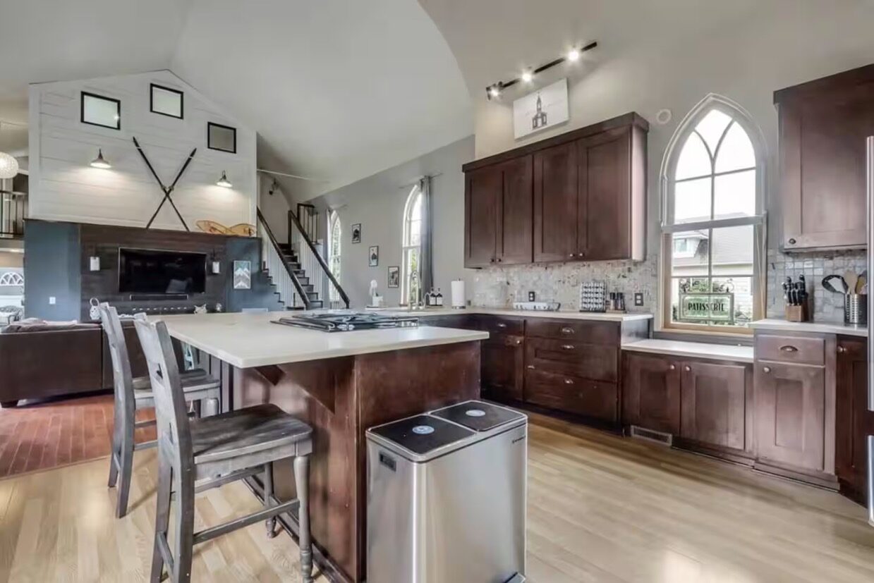 Kitchen with dark cabinets and island seating