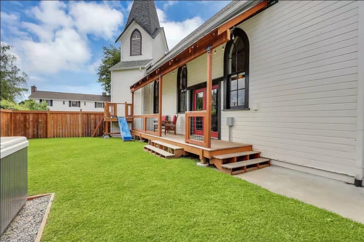 Fenced backyard with play area